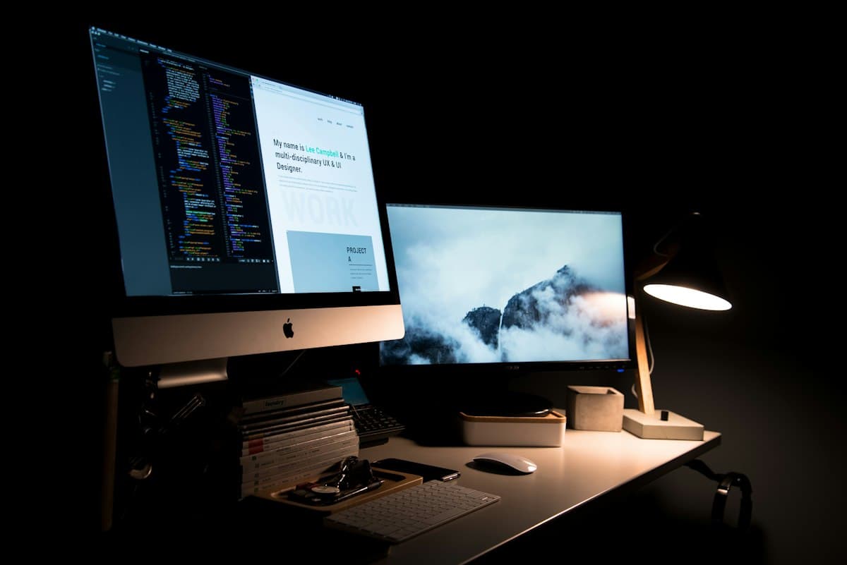 Designer workspace with page designs on screen